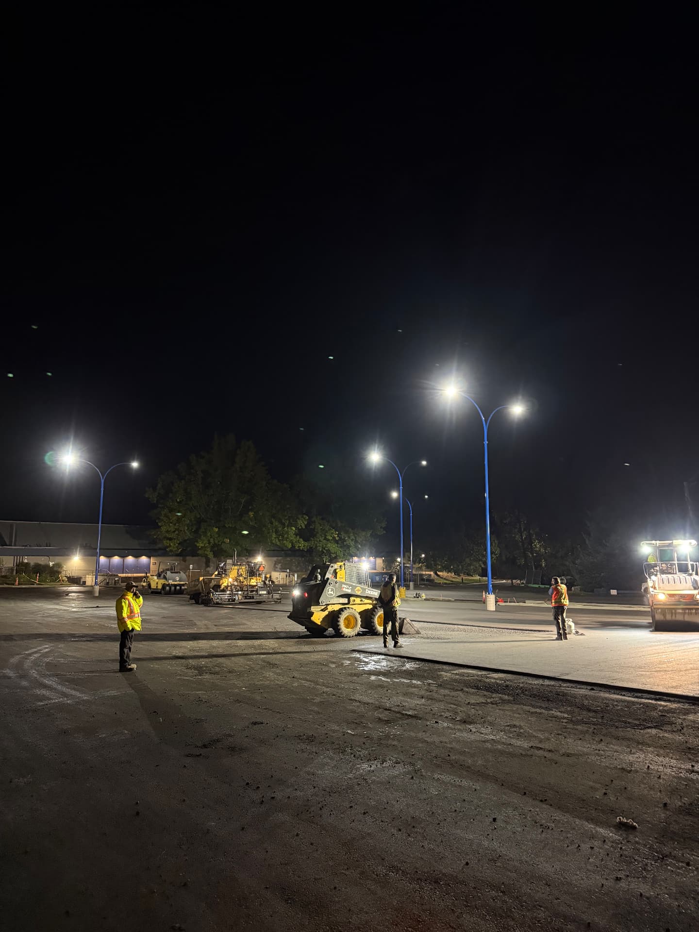 Arcane Electric crew and equipment working under newly installed LED streetlights at night